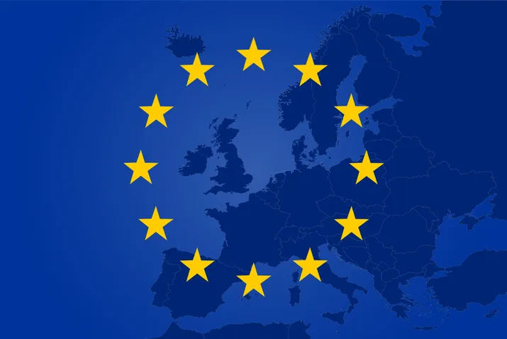 EU flag over a map of Europe — MiCA sets the regulatory frame for stablecoins